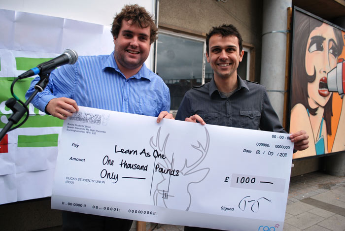 Tom Foy presenting me with a cheque for £1,000.